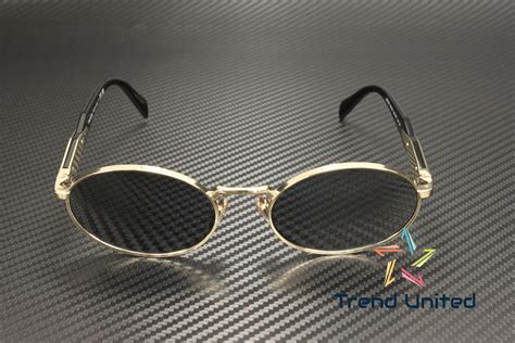 Prada PR 65ZS Gold ZVN09T Sunglasses for Women.